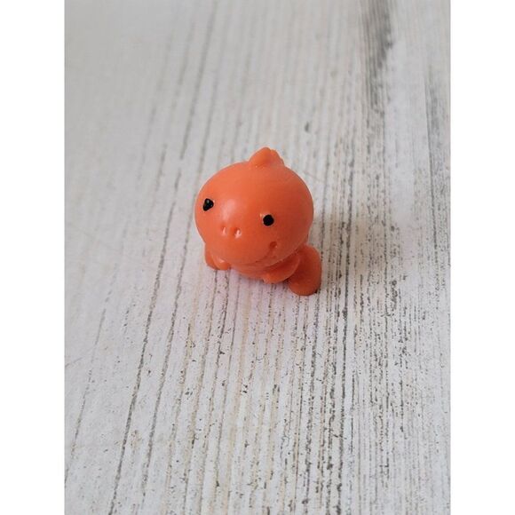 Orange miniature rubber Trex dinosaur toy figure - Picture 1 of 4